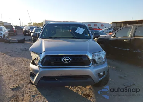 2014 Toyota Tacoma Base V6 z USA, uszkodzony, nr VIN 3TMLU4EN1EM144853